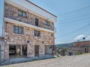 Nine-unit apartment building with varied layouts—ideal for investment.