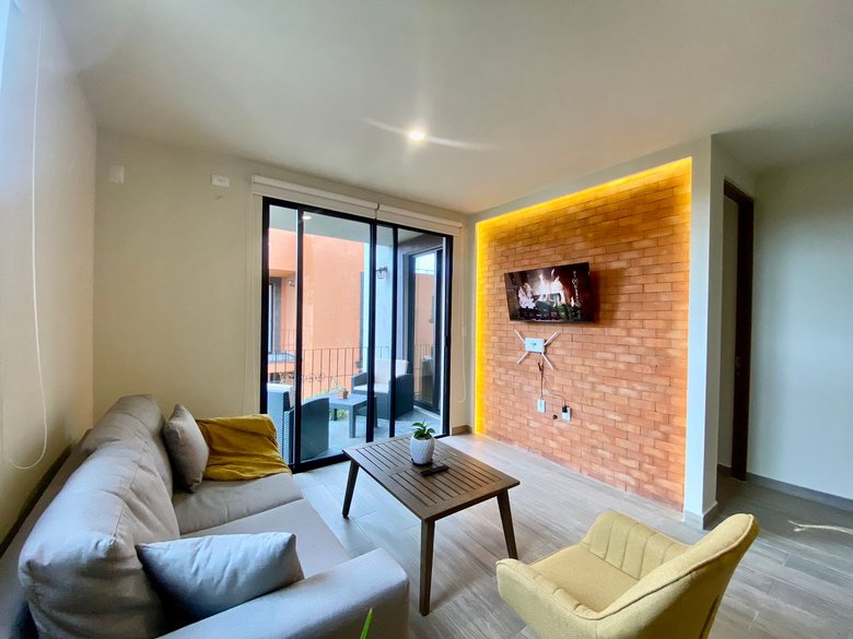 Modern Minimalist 2BR + Private Rooftop | Pool + Gym | Near Centro — 2 photos
